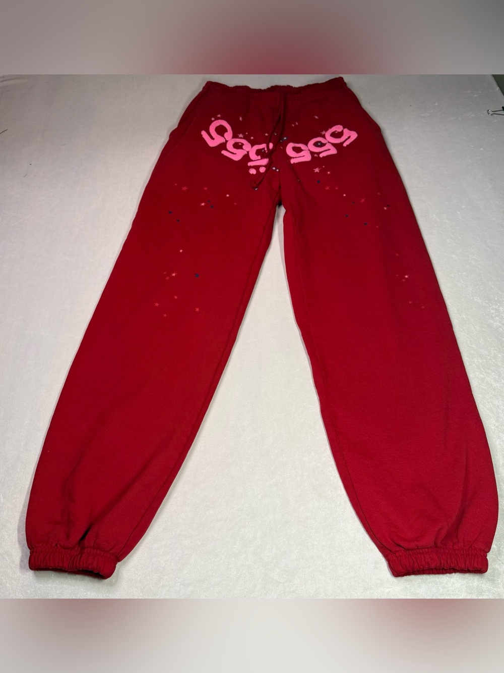 Sp5der 555 Angel Number Sweatpants in Red Featuring Pink Graphic Lettering
